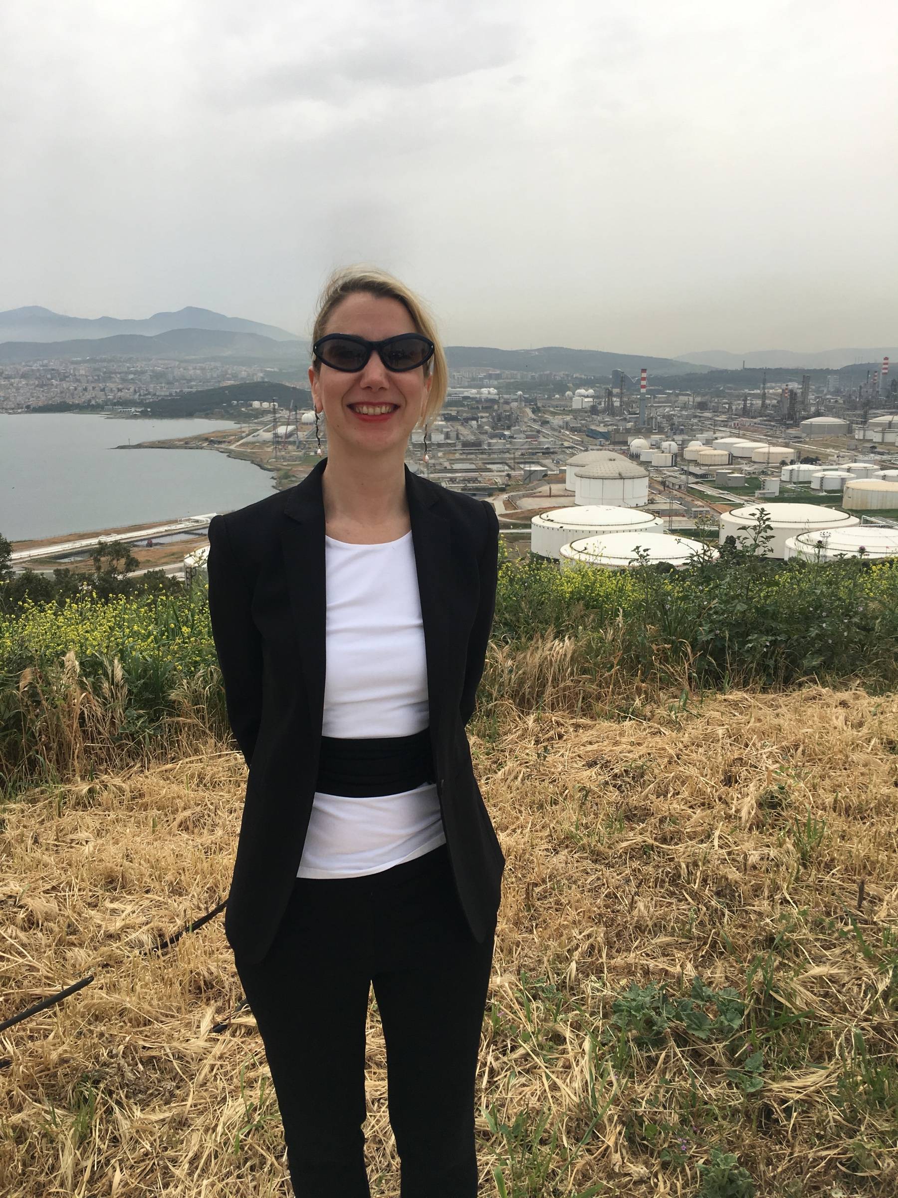 Asli Gulcur overlooking the Tüpraş refinery, storage terminals, and surrounding industrial landscape